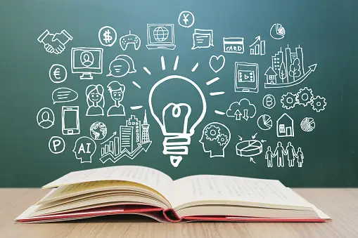 Open book with innovation and business strategy icons