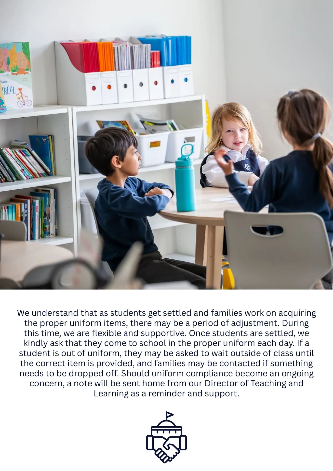Three children sitting at a round table in classroom.