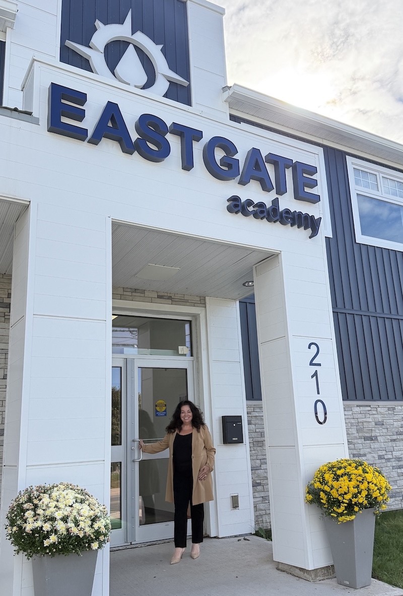 Woman standing outside Eastgate Academy entrance